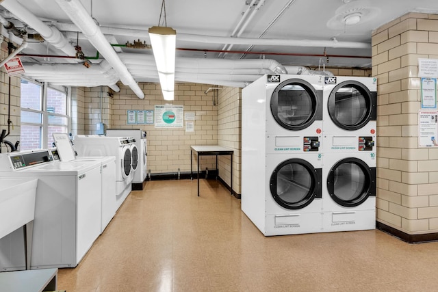 2601 Henry Hudson Pkwy Unit 5E, Bronx, NY 10463 - community laundry with separate washer and dryer, stacked washer and clothes dryer, and light floors