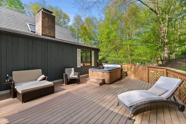 wooden terrace with a hot tub