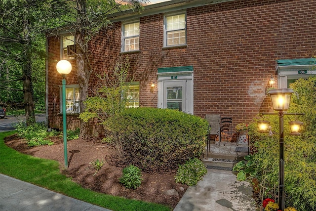 view of front of home with brick siding
