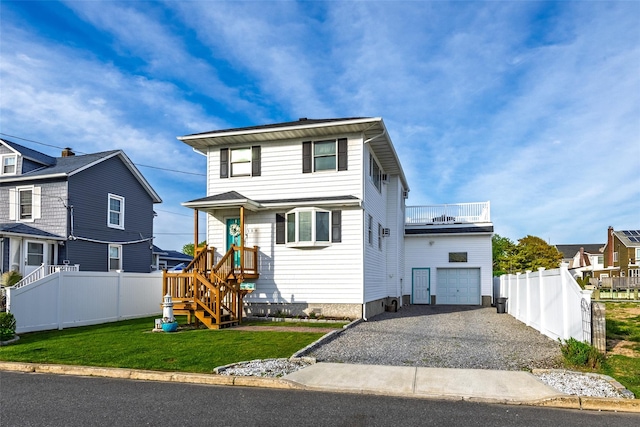 159 Araca Rd, Babylon, NY 11702 - view of front facade featuring driveway and an attached garage