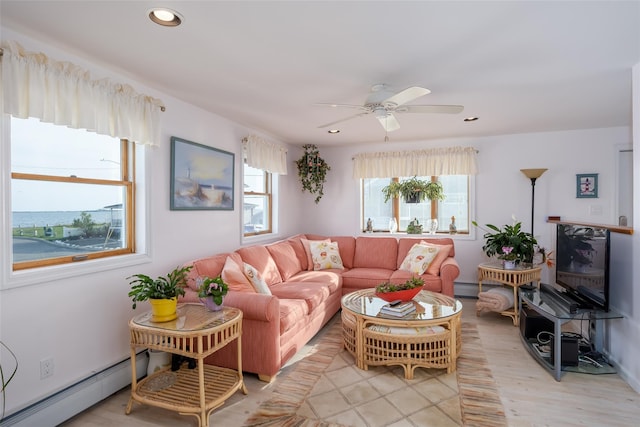 159 Araca Rd, Babylon, NY 11702 - living area with baseboard heating, a ceiling fan, recessed lighting, and light wood-type flooring