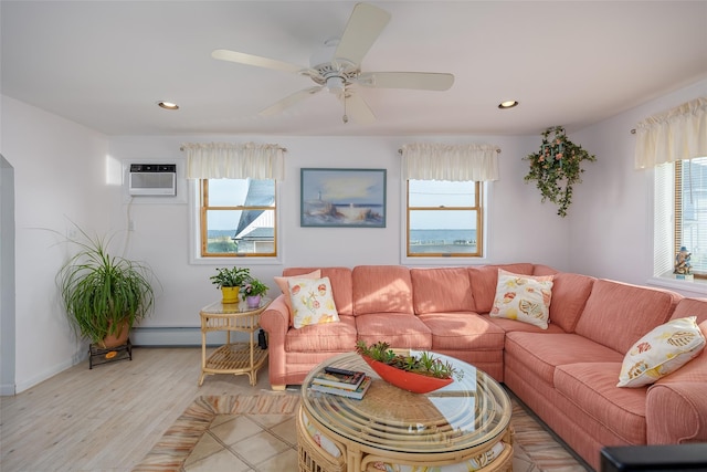 159 Araca Rd, Babylon, NY 11702 - living room with light wood finished floors, recessed lighting, a wall mounted AC, ceiling fan, and baseboard heating