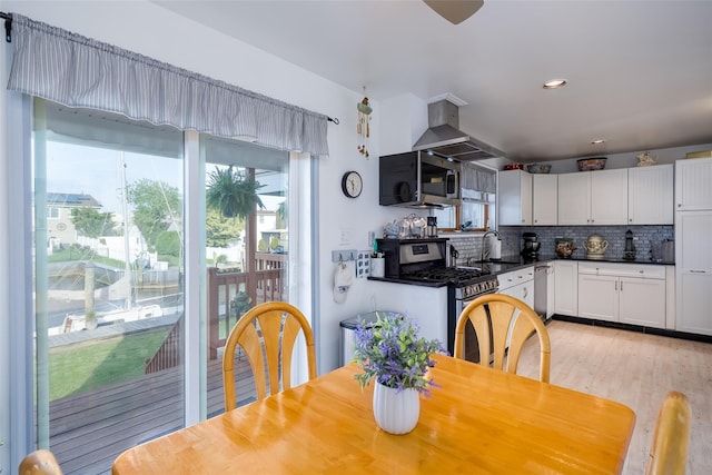 159 Araca Rd, Babylon, NY 11702 - dining area with light wood-style floors and recessed lighting