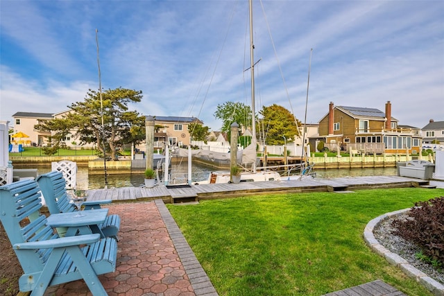 159 Araca Rd, Babylon, NY 11702 - dock area featuring a residential view, a lawn, and a water view