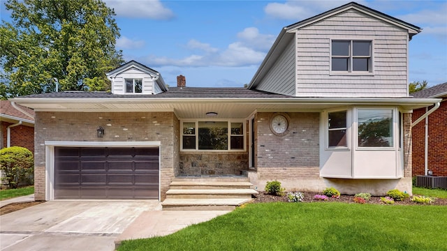 view of front of house with brick siding, central AC, a front lawn, and concrete driveway