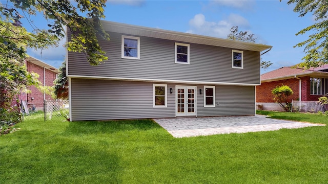 rear view of property featuring a patio and french doors