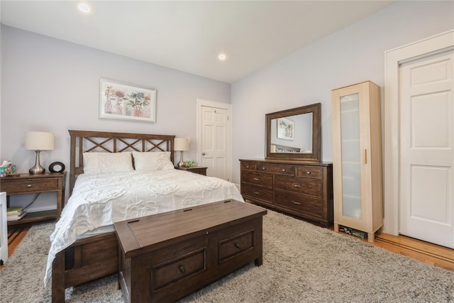 bedroom featuring wood finished floors and recessed lighting