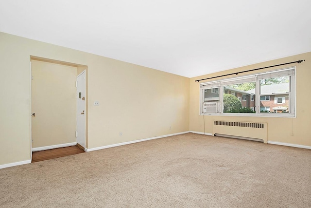 121 N Broadway # 31A, White Plains, NY 10603 - carpeted spare room with radiator heating unit, baseboards, and cooling unit