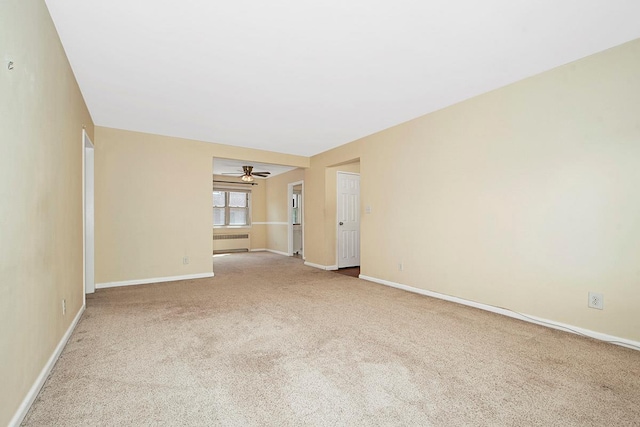 121 N Broadway # 31A, White Plains, NY 10603 - carpeted spare room featuring radiator heating unit, ceiling fan, and baseboards