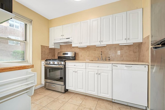 121 N Broadway # 31A, White Plains, NY 10603 - kitchen featuring dishwasher, stainless steel gas range, a sink, under cabinet range hood, and light countertops
