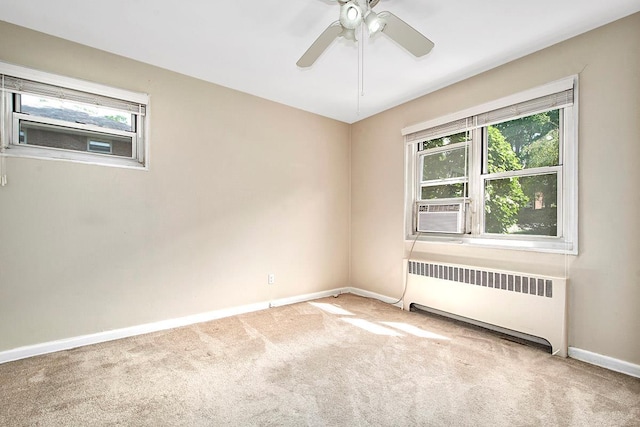 121 N Broadway # 31A, White Plains, NY 10603 - carpeted empty room with radiator heating unit, baseboards, a ceiling fan, and cooling unit