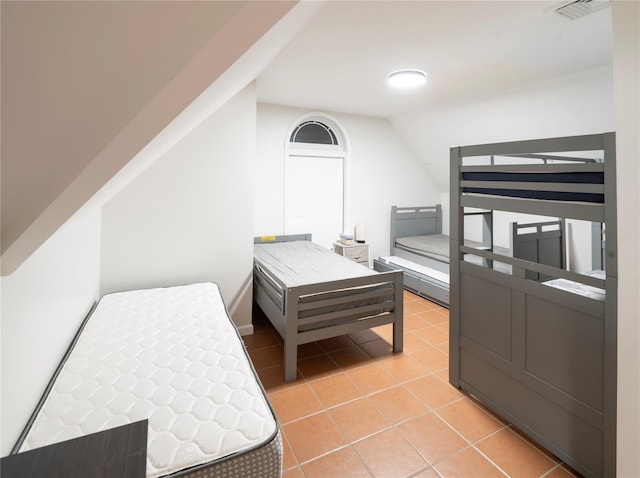 10-12 Damian Ct, Chester, NY 10918 - bedroom with light tile patterned floors and lofted ceiling