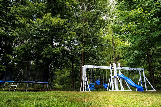 10-12 Damian Ct, Chester, NY 10918 - community playground with a trampoline, a lawn, and a forest view