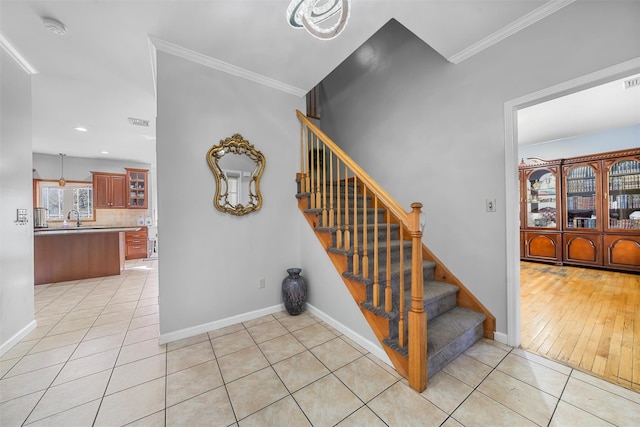 10-12 Damian Ct, Chester, NY 10918 - stairway with tile patterned floors, crown molding, baseboards, and recessed lighting