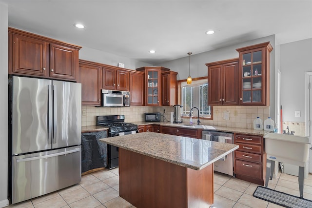 10-12 Damian Ct, Chester, NY 10918 - kitchen with appliances with stainless steel finishes, a sink, hanging light fixtures, light tile patterned floors, and recessed lighting