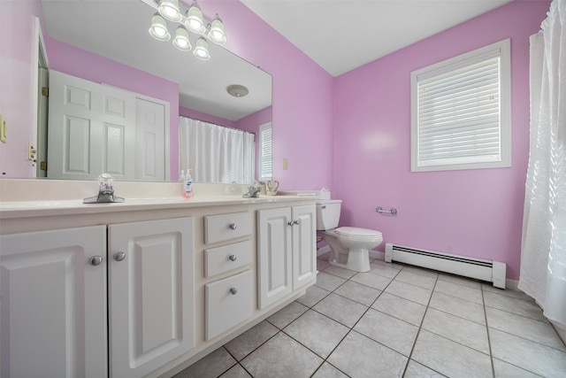 10-12 Damian Ct, Chester, NY 10918 - full bath with a baseboard radiator, toilet, double vanity, tile patterned flooring, and baseboards