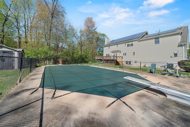 10-12 Damian Ct, Chester, NY 10918 - view of swimming pool featuring a wooden deck, fence, a patio area, and a diving board