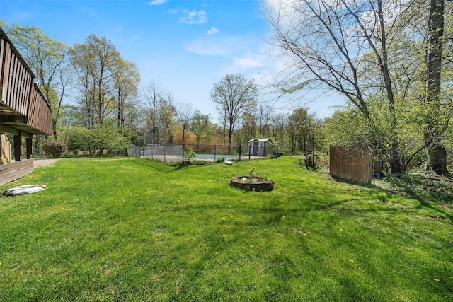 10-12 Damian Ct, Chester, NY 10918 - view of yard with a shed, an outbuilding, and an outdoor fire pit