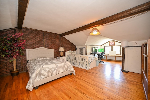 bedroom featuring vaulted ceiling with beams, brick wall, and wood finished floors