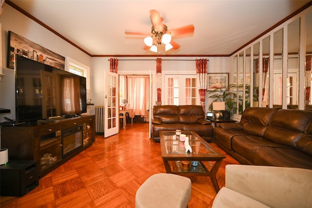 living area featuring french doors, a ceiling fan, and crown molding