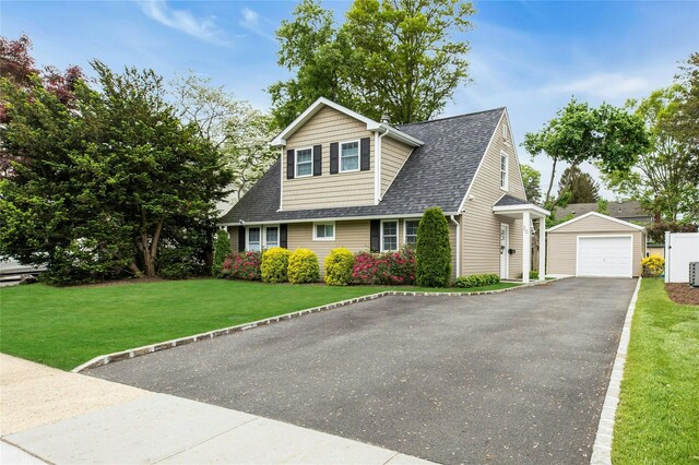 20 Robert Rd, Glen Cove, NY 11542 - view of front of home featuring an outbuilding, a garage, roof with shingles, a front lawn, and asphalt driveway