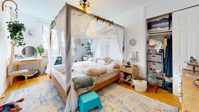 bedroom featuring a closet and wood finished floors