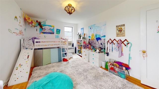 bedroom featuring wood finished floors