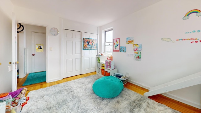 game room featuring baseboards and wood finished floors