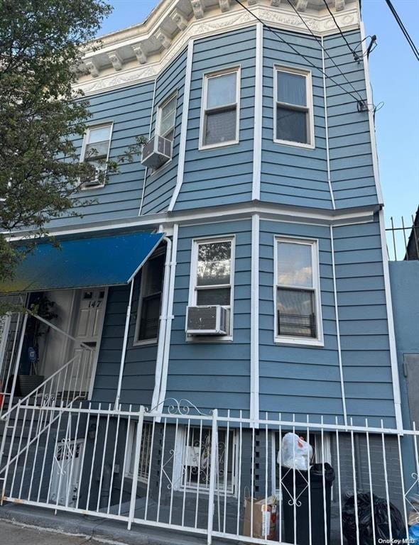view of front facade with cooling unit