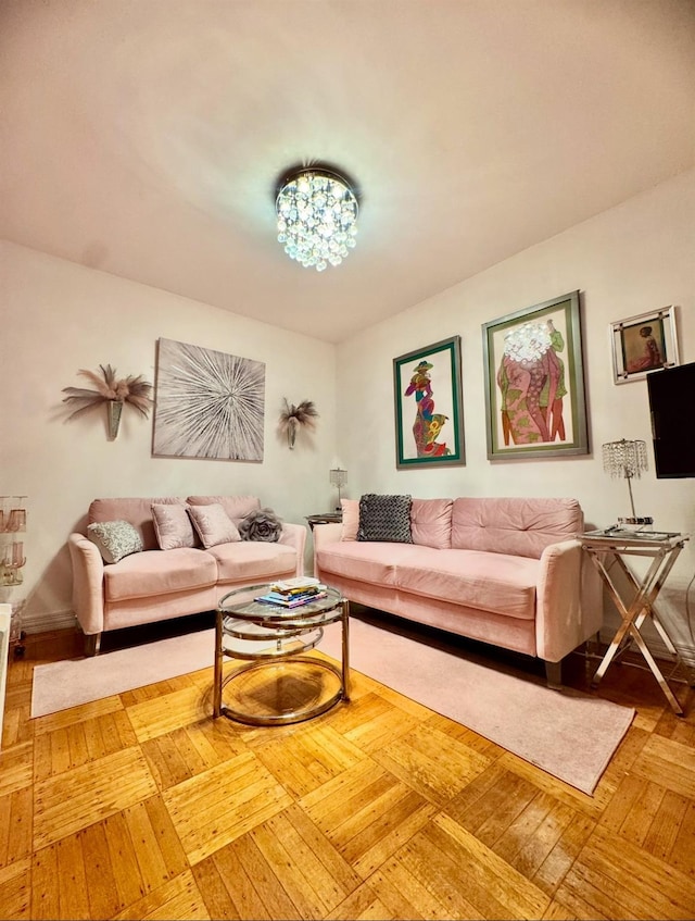 living area featuring a chandelier