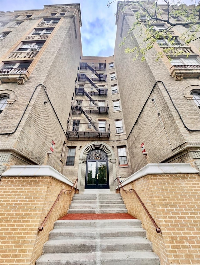 exterior space with brick siding