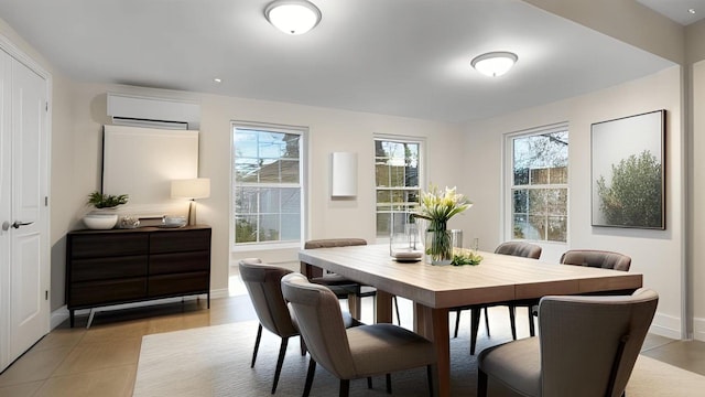 dining space featuring baseboards and a wall mounted AC