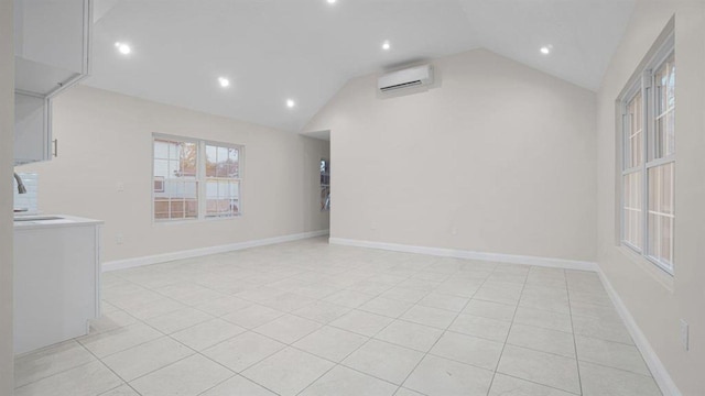 unfurnished living room with light tile patterned flooring, baseboards, a wall mounted air conditioner, recessed lighting, and vaulted ceiling