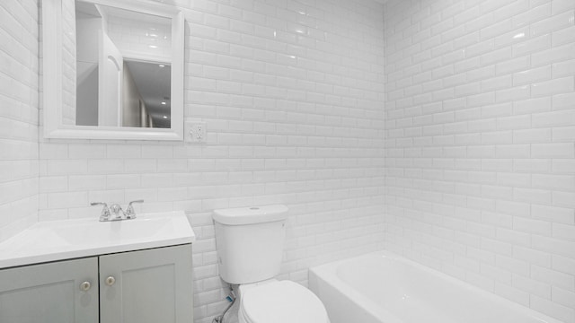 bathroom with vanity, toilet, tile walls, walk in shower, and a tub