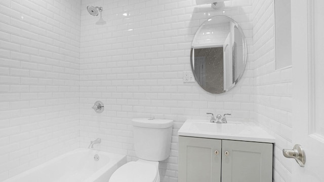 bathroom featuring toilet, washtub / shower combination, and vanity