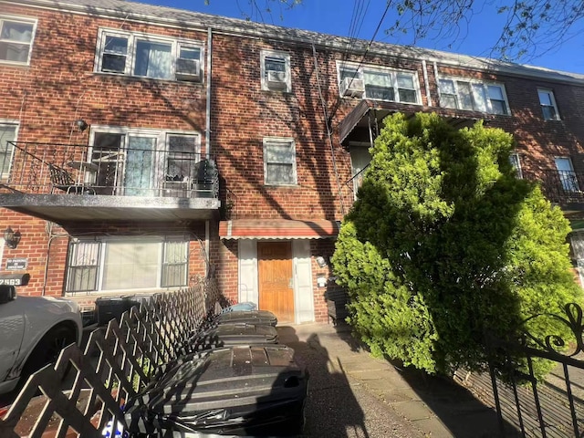 townhome / multi-family property featuring brick siding