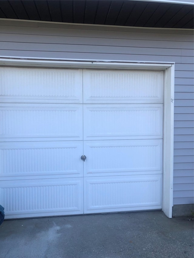 garage featuring aphalt driveway
