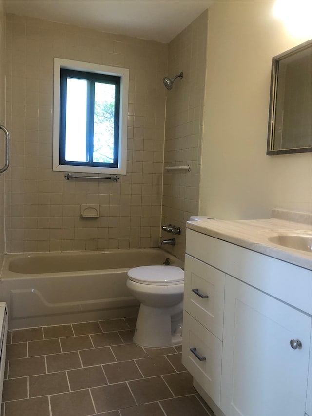 full bath featuring shower / bathtub combination, toilet, tile patterned flooring, and vanity