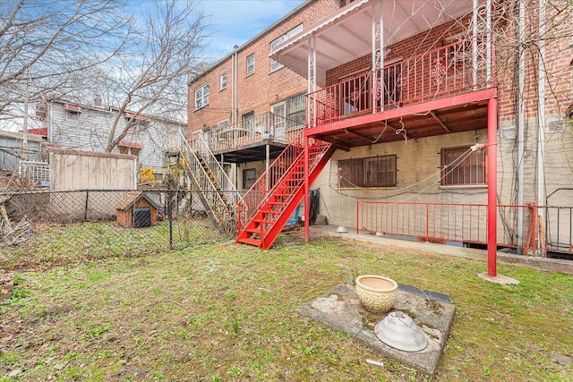 3135 Gunther Ave, Bronx, NY 10469 - back of property featuring a lawn, fence, stairway, and a deck