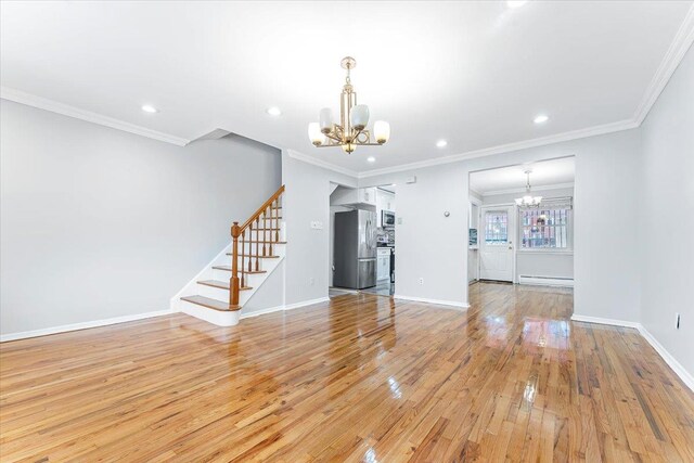 3135 Gunther Ave, Bronx, NY 10469 - unfurnished living room with recessed lighting, a chandelier, light wood-style flooring, and stairway