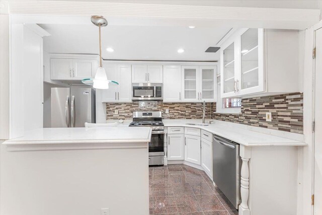3135 Gunther Ave, Bronx, NY 10469 - kitchen with decorative backsplash, granite finish floor, a sink, stainless steel appliances, and white cabinetry
