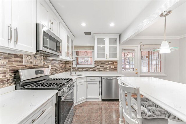 3135 Gunther Ave, Bronx, NY 10469 - kitchen featuring white cabinets, a sink, granite finish floor, stainless steel appliances, and backsplash