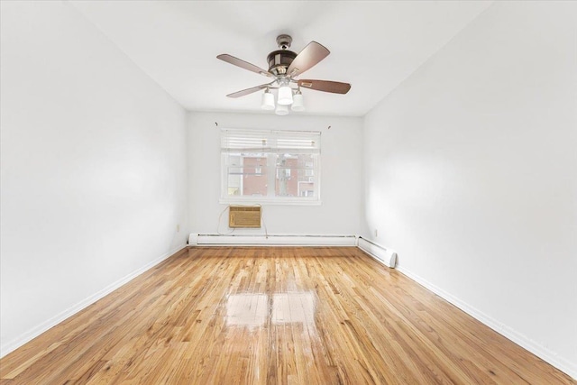 3135 Gunther Ave, Bronx, NY 10469 - spare room featuring baseboards, ceiling fan, a baseboard heating unit, and wood finished floors