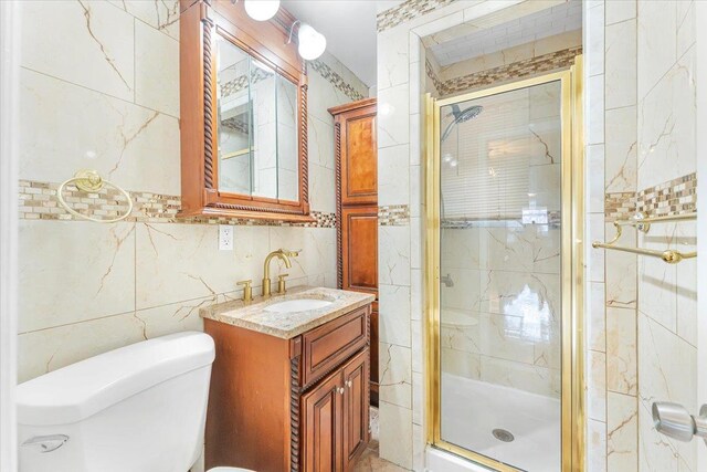 3135 Gunther Ave, Bronx, NY 10469 - full bathroom featuring vanity, a stall shower, toilet, and tile walls