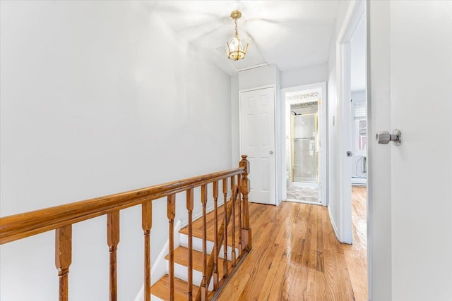 3135 Gunther Ave, Bronx, NY 10469 - hall with an upstairs landing and light wood finished floors