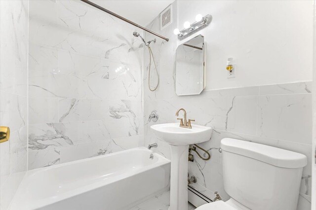 3135 Gunther Ave, Bronx, NY 10469 - full bath with marble finish floor, toilet, tile walls, baseboard heating, and shower / tub combination