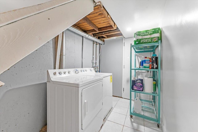 3135 Gunther Ave, Bronx, NY 10469 - washroom with light tile patterned floors, laundry area, and washing machine and clothes dryer
