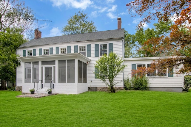 711 Homestead Ave, Maybrook, NY 12543 - back of house with a chimney, a sunroom, and a lawn