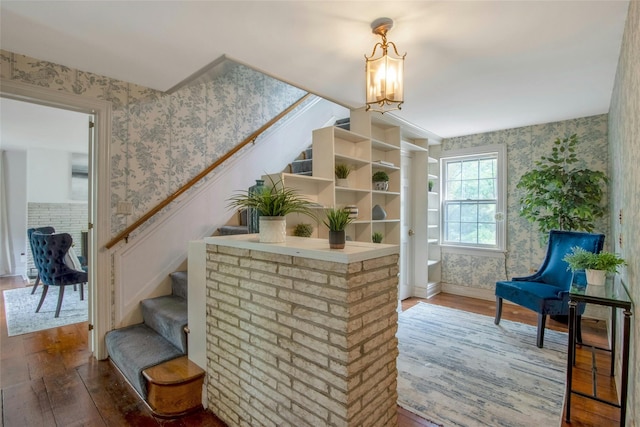 711 Homestead Ave, Maybrook, NY 12543 - living area featuring wallpapered walls, stairway, and hardwood / wood-style flooring