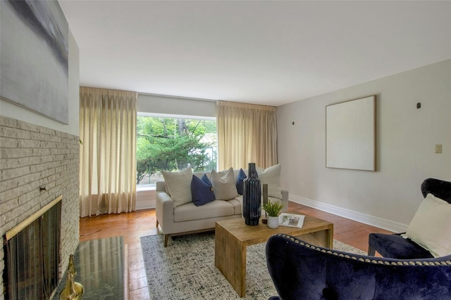 711 Homestead Ave, Maybrook, NY 12543 - living room featuring baseboards, a fireplace, and wood finished floors